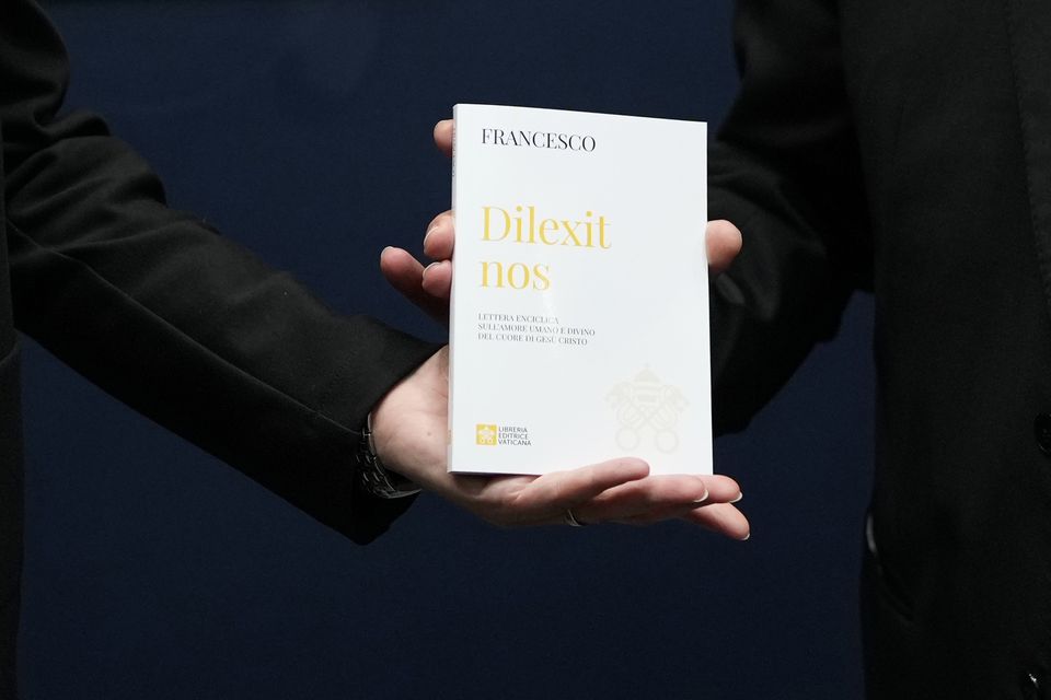 A copy of Pope Francis’ encyclical titled ‘Dilexit Nos’, Latin for ‘He Loves Us’, is shown after a press conference for its presentation at the Vatican (Alessandra Tarantino/AP)