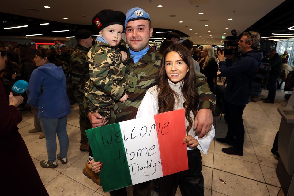 Calvin Conway is reunited with his son Rian, three, and girlfriend Nicole O’Flaherty (Liam McBurney/PA)