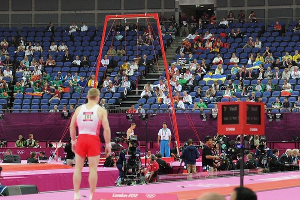 Empty seats are seen during the artistic gymnastics team qualification at the North Greenwich Arena, London
