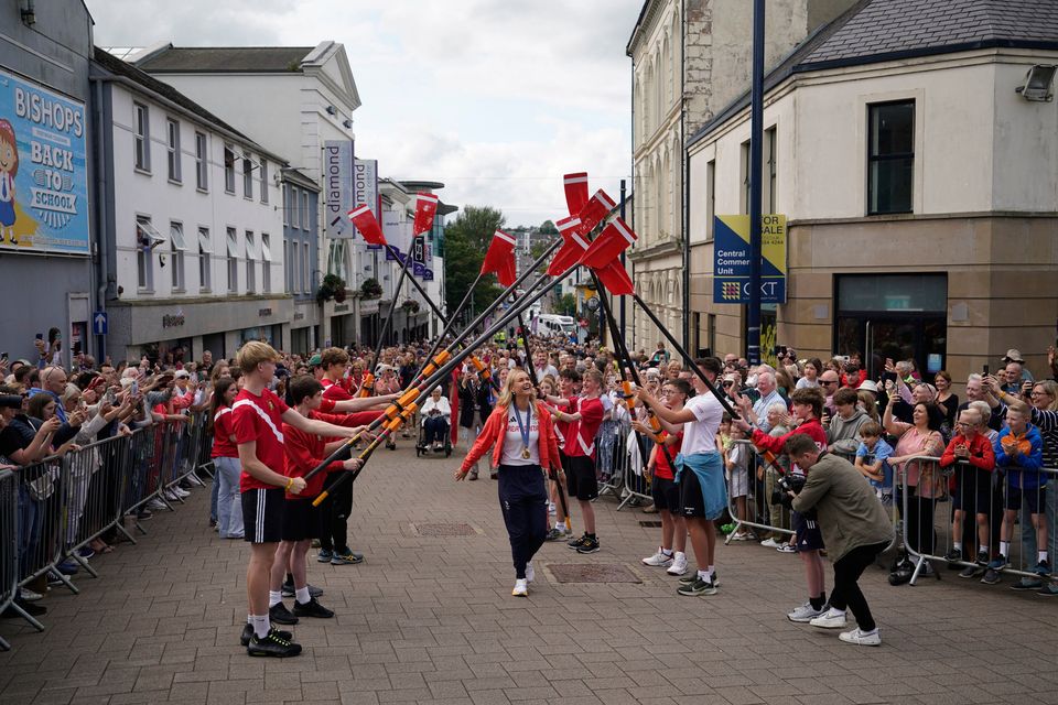 Members of Bann Rowing Club formed a guard of honour as Hannah made her way to the Town Hall. Pic: Niall Carson/PA Wire