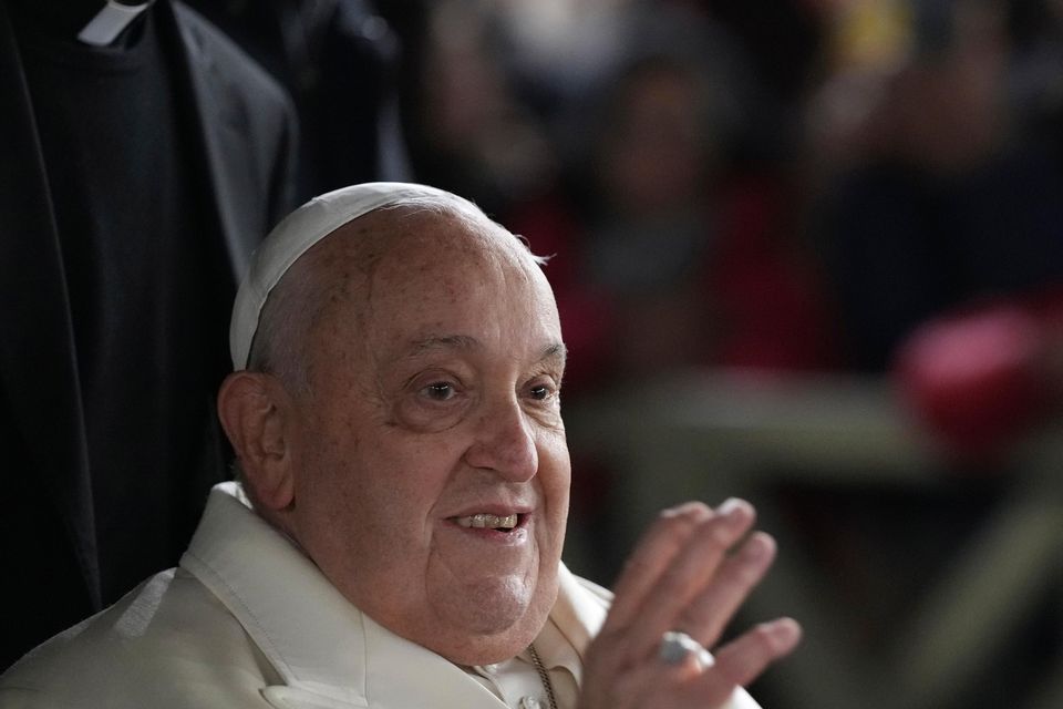 Pope Francis waves at worshippers congregated in St Peter’s Square after celebrating New Year’s Eve Vespers and Te Deum at the Vatican (Andrew Medichini/AP)