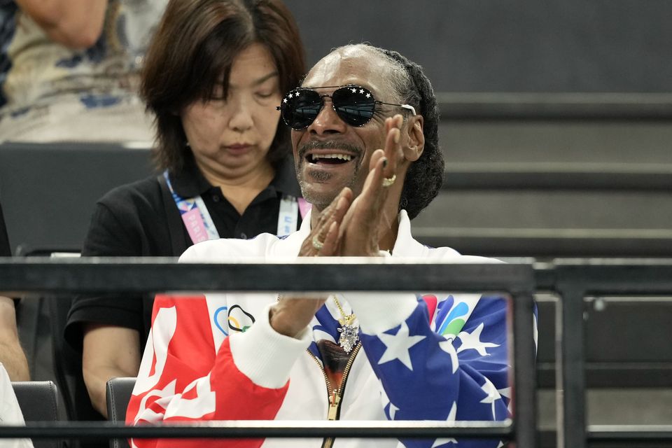 Snoop Dogg was in party mood as he attended the women’s artistic gymnastics qualification round in Paris (Charlie Riedel/AP)