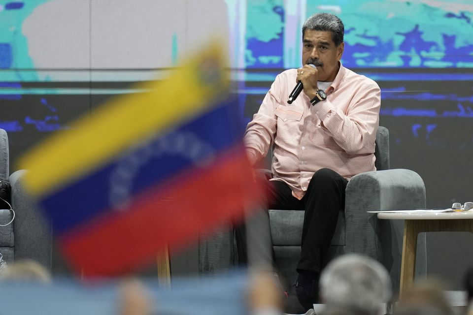 Venezuelan President Nicolas Maduro speaks during a meeting with international observers in Caracas (Matias Delacroix/AP)