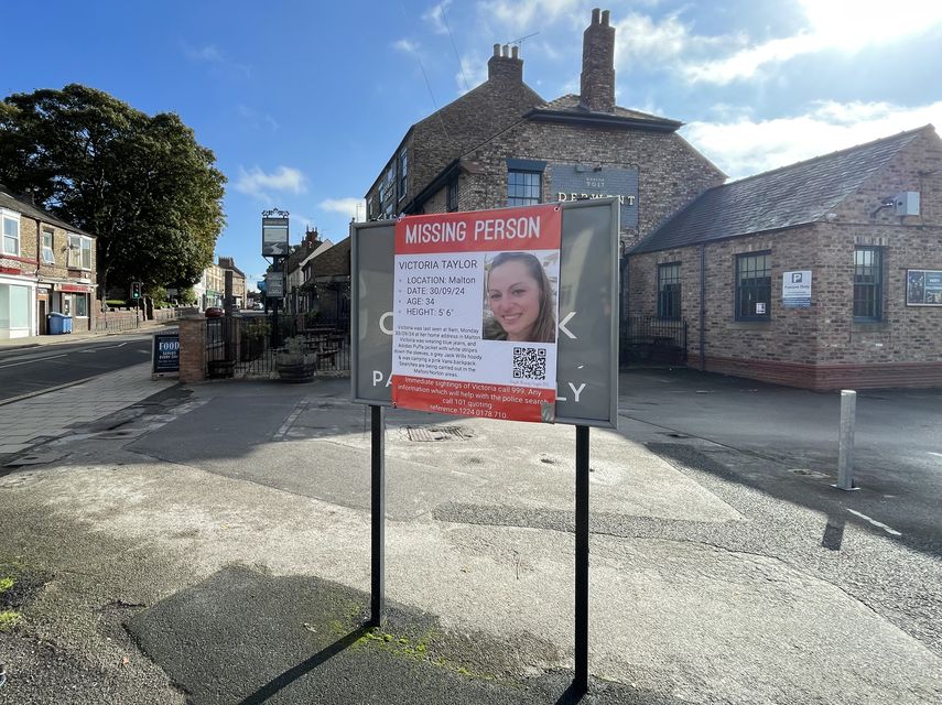 A poster appealing for information regarding Victoria Taylor outside the Derwent Arms public house in Malton (Dave Higgens/PA)