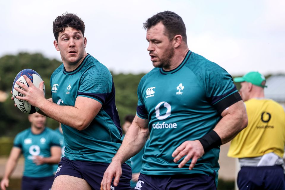 Ulster's Tom Stewart with Ireland veteran Cian Healy during a training session 