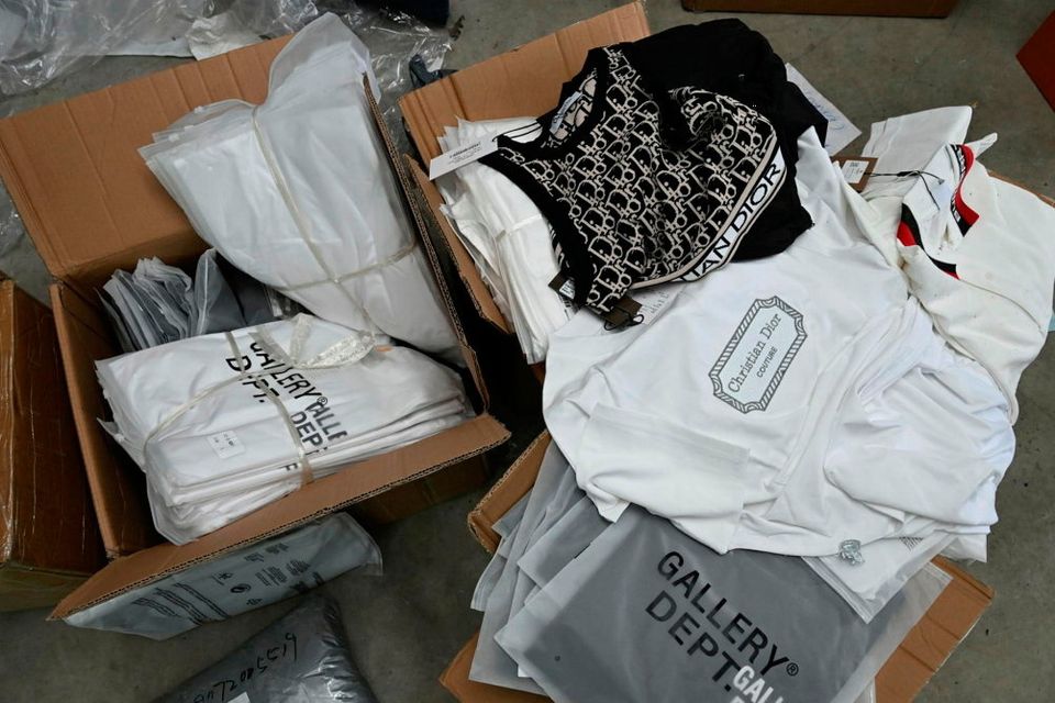 Fake designer clothes found during the Dungiven search. Credit: PSNI 