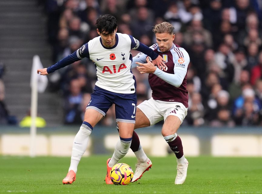 Son Heung-min (left) and Matty Cash battle for the ball (John Walton/PA)