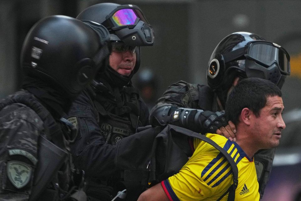 Police detain a soccer fan who joined retirees protesting for higher pensions and against austerity measures implemented by Javier Milei’s government in Buenos Aires (AP/Natacha Pisarenko)