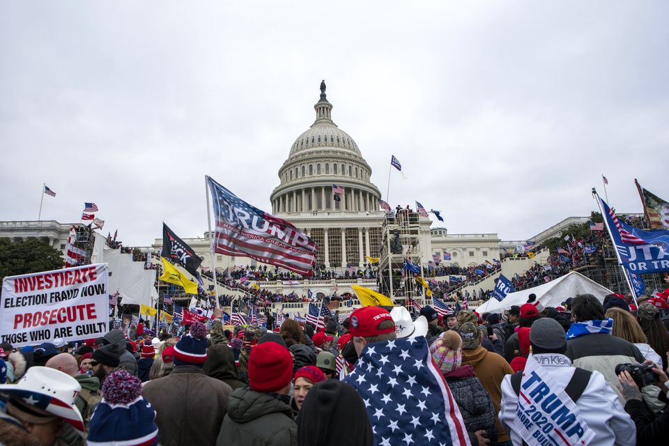 People attack the US Capitol in Washington on January 6 2021 (AP/Jose Luis Magana)