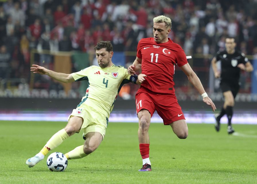 Wales captain Ben Davies challenges Turkey forward Baris Alper Yilmaz in Kayseri (Huseyin Yavuz/Dia Photo via AP)