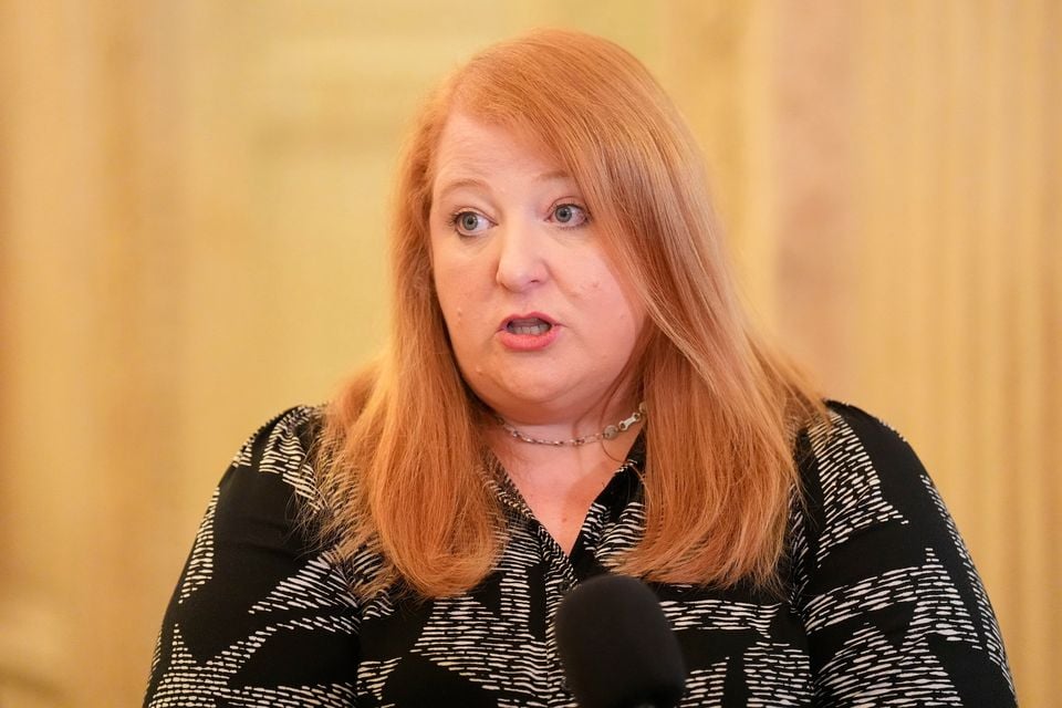 Justice Minister Naomi Long speaking to the media at Parliament Buildings at Stormont.