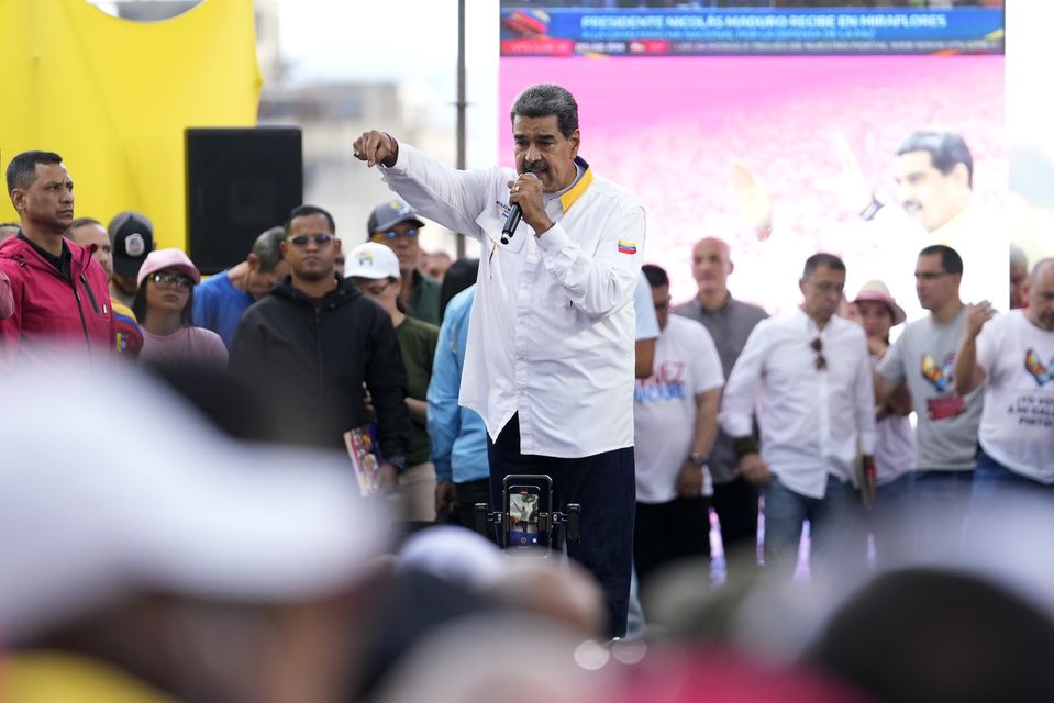 President Nicolas Maduro speaks to supporters during a government rally in Caracas (Matias Delacroix/AP)