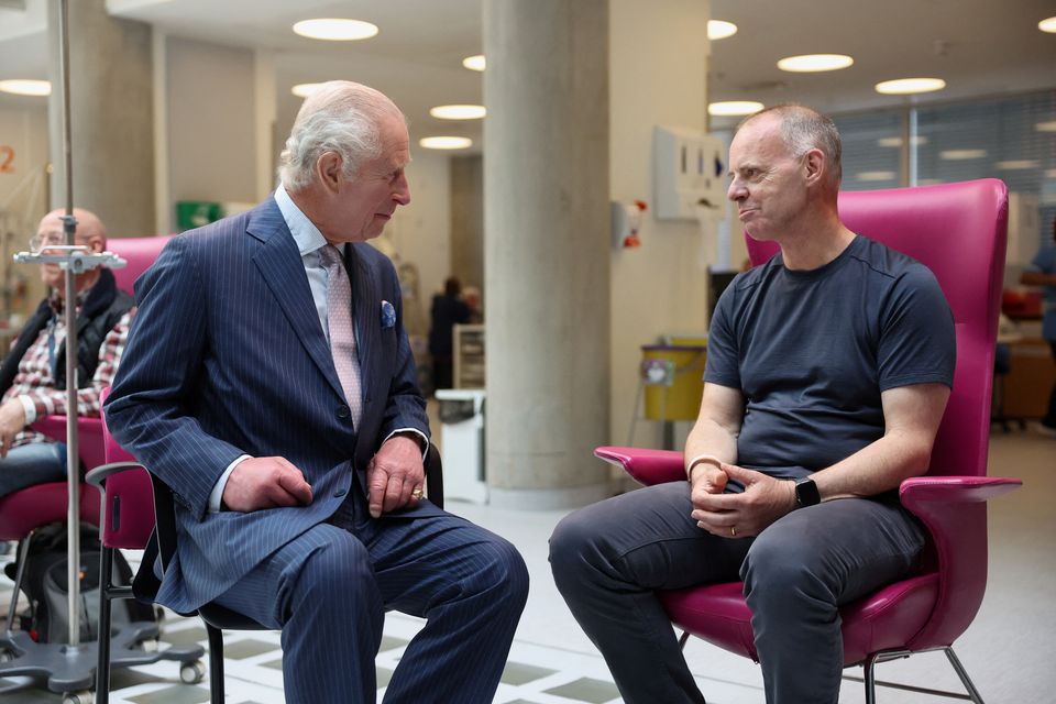 Charles, patron of Cancer Research UK and Macmillan Cancer Support, meets patient Huw Stiley during a visit to University College Hospital Macmillan Cancer Centre in London (Suzanne Plunkett/PA)