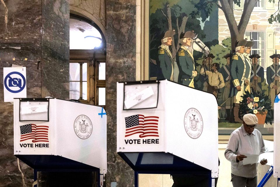 Voters cast their ballots at the Bronx County Supreme Court in New York on Election Day (Yuki Iwamura/AP)