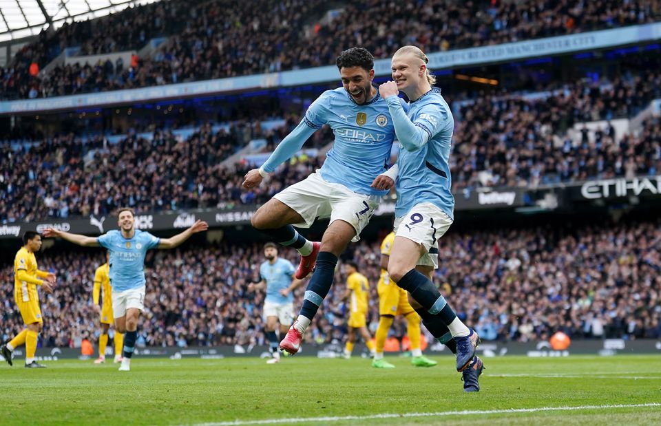 City were pegged back after goals from Erling Haaland, right, and Omar Marmoush (Martin Rickett/PA)