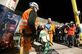 thumbnail: SAN JOSE MINE, CHILE - OCTOBER 13: (NO SALES, NO ARCHIVE) In this handout from the Chilean government, Carlos Mamani, 23, becomes the fourth miner to exit the rescue capsule, on October 13, 2010 at the San Jose mine near Copiapo, Chile. The rescue operation has begun bringing up the 33 miners, 69 days after the August 5, 2010 collapse that trapped them half a mile underground. (Photo by Hugo Infante/Chilean Government via Getty Images)