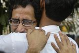 thumbnail: A grieving relative of a terrorist attack victim, facing camera, is consoled by other outside the St. Georges Hospital in Mumbai, India, Thursday, Nov. 27, 2008. Teams of gunmen stormed luxury hotels, a popular restaurant, hospitals and a crowded train station in coordinated attacks across India's financial capital, killing at least 101 people, taking Westerners hostage and leaving parts of the city under siege Thursday, police said. A group of suspected Muslim militants claimed responsibility. (AP Photo/Gurinder Osan)