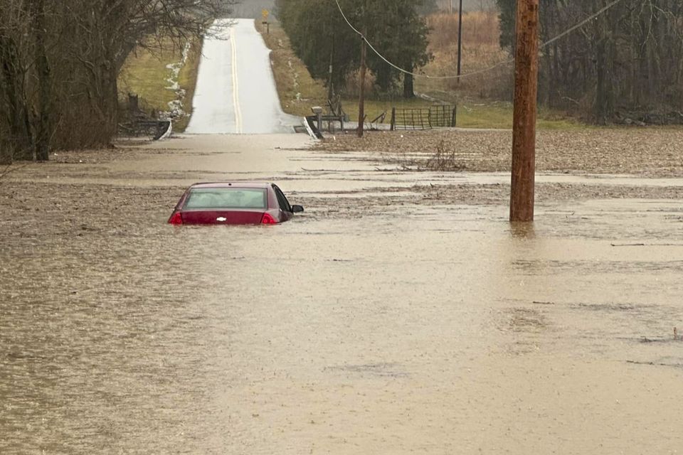 A partially submerged car outside of Bowling Green, Kentucky (Warren County Sheriff’s Office via AP)