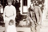 thumbnail: Princess Elizabeth with her grandparents King George V and Queen Mary; and Snip the King's Cairn terrier, 1928.