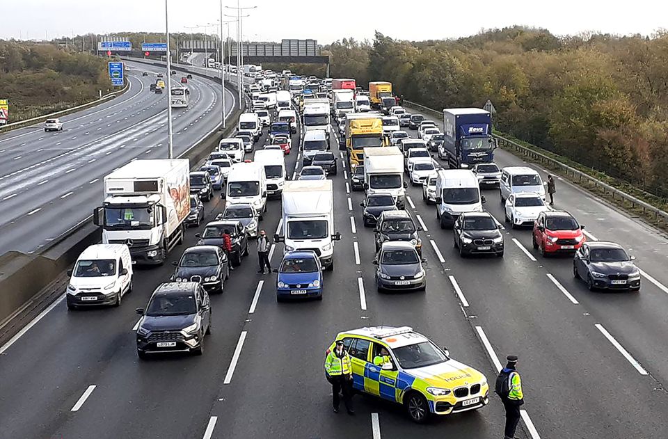 Police closing the M25, where demonstrators from Just Stop Oil, climbed the gantry in 2022 (Just Stop Oil)