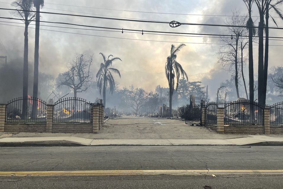 Homes have been destroyed in the fires, which firefighters are battling to control (EJ Soto/AP)