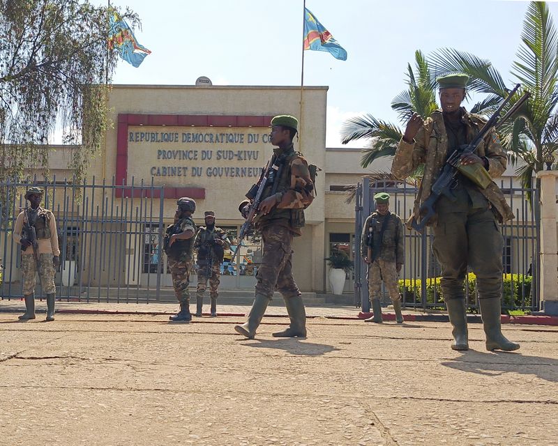 M23 rebels guard the South Kivu province administrative office in Bukavu (Janvier Barhahiga/AP)