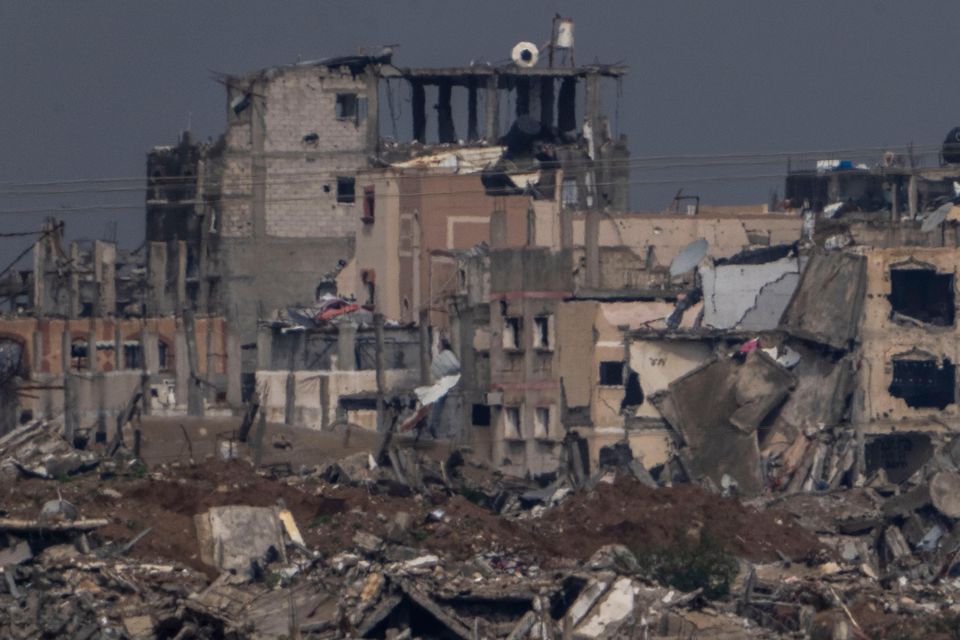 Destroyed buildings by Israeli bombardments inside the northern Gaza Strip as seen from southern Israel (Ariel Schalit/AP)