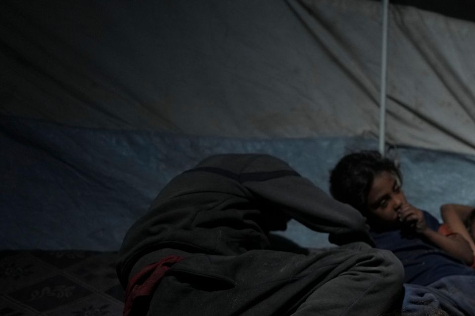 Children sleep in their tent at a camp for displaced people in Deir al-Balah, Gaza Strip (Abdel Kareem Hana/AP)