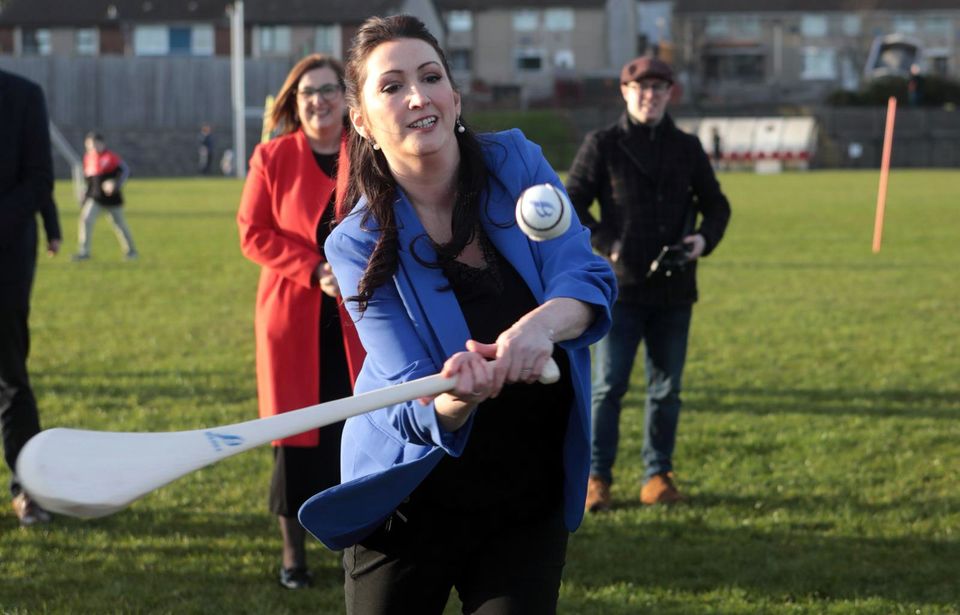 Emma Little-Pengelley has a go at hurling at St Paul's GAA club in west Belfast (Pacemaker)