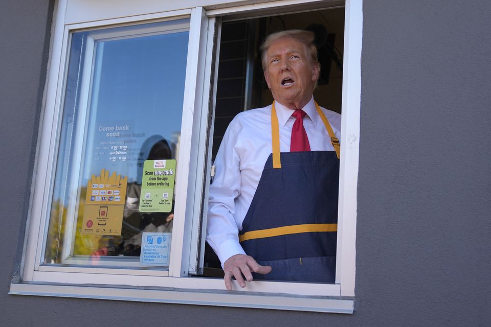 Donald Trump speaks from a drive-thru window (Evan Vucci/AP)