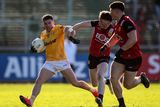 thumbnail: Patrick McBride of Antrim is tackled by Miceal Rooney during the Saffrons' Ulster Championship defeat to Down
