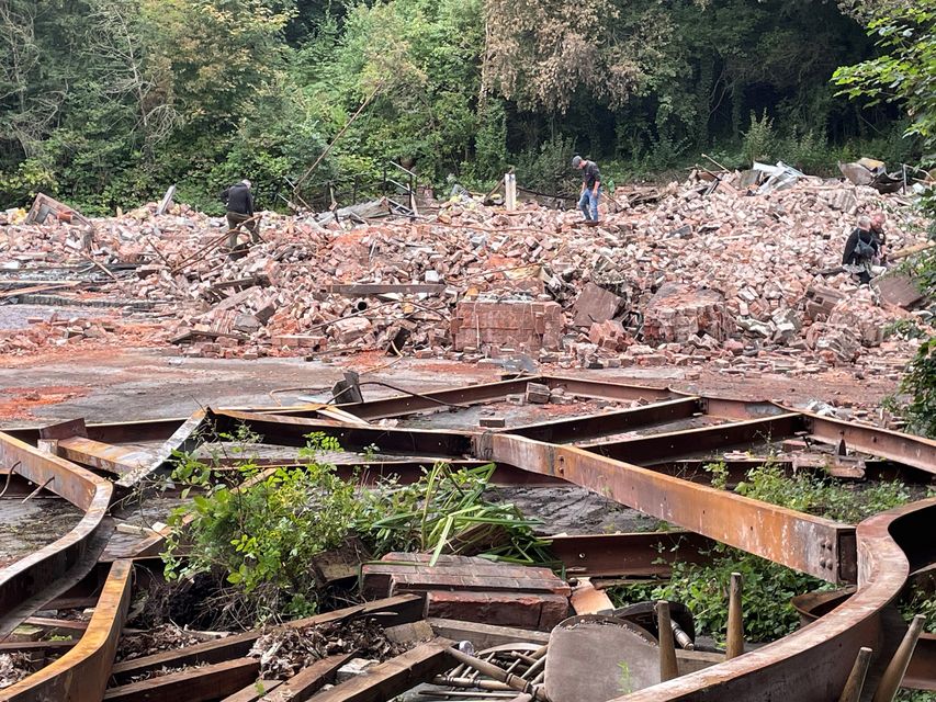 People inspect the remains of The Crooked House pub in Himley, near Dudley in the West Midlands, which was demolished two days after it was gutted by fire (Matthew Cooper/PA)