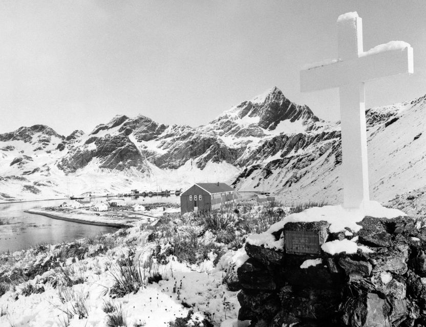 The Memorial Cross to Sir Ernest Shackleton at Hope Point, South Georgia, overlooking the British Antarctic Survey’s Grytviken station (PA)