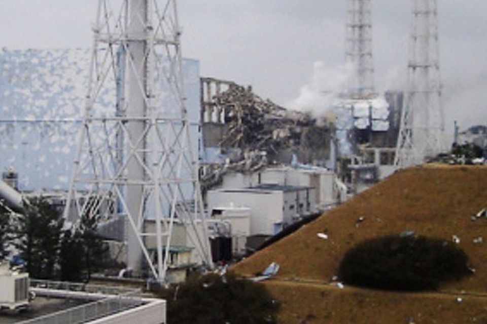 Smoke rises from the No 3 unit at the Fukushima Dai-ichi nuclear complex in Okumamachi, north-eastern Japan (AP)