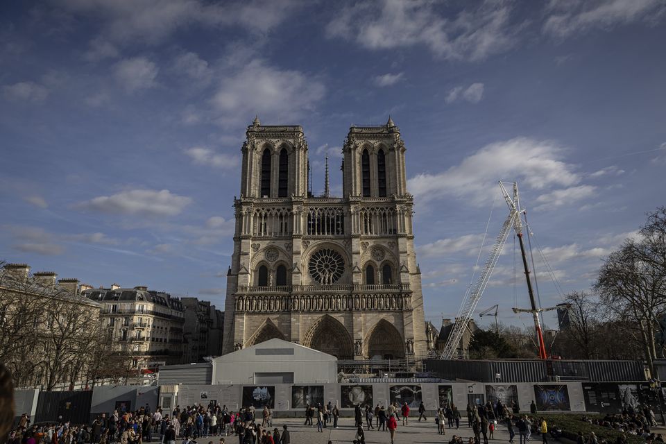 Scaffolding is removed around the spire of Notre Dame in February (Aurelien Morissard/AP)