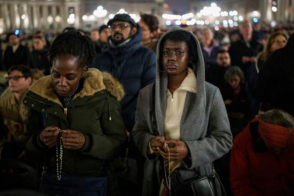 Faithful gather to pray the rosary for the health of Pope Francis (AP/Bernat Armangue)