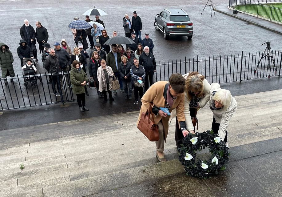 A wreath is laid on the steps of Parliament Buildings as families of the Disappeared conclude their silent walk (David Young/PA)