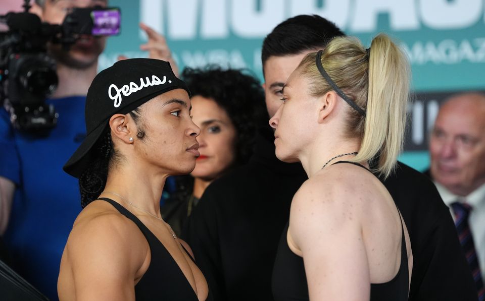Jessica McCaskill (left) and Lauren Price face off during the weigh-in ahead of their world title fight in Cardiff (Bradley Collyer/PA)