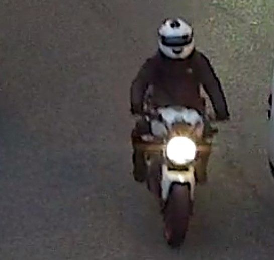 A photograph, taken just before the shooting in Dalston, of the motorcyclist police want to trace (Metropolitan Police/PA)