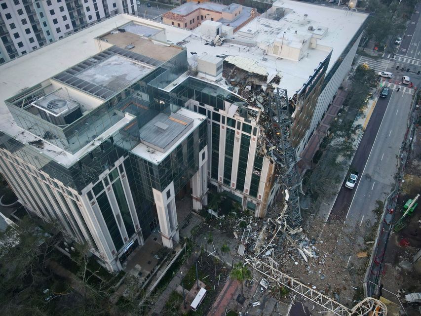 A construction crane fell over into an office building that houses the Tampa Bay Times headquarters (Tampa Bay Times via AP)