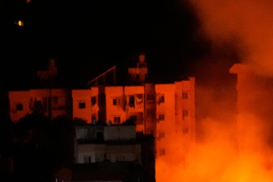 Flame and smoke rises from buildings hit by Israeli airstrikes on Dahiyeh, in the southern suburb of Beirut (Hussein Malla/AP)