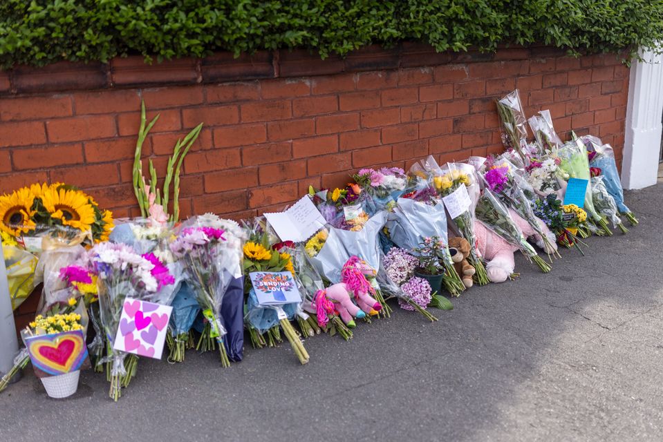 Floral tributes near the scene of the incident in Hart Street, Southport (James Speakman/PA)