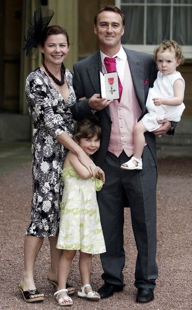 Amanda Thorpe, left, with Graham Thorpe and their children as the former England batter received his MBE in 2007 (Andrew Parsons/PA)