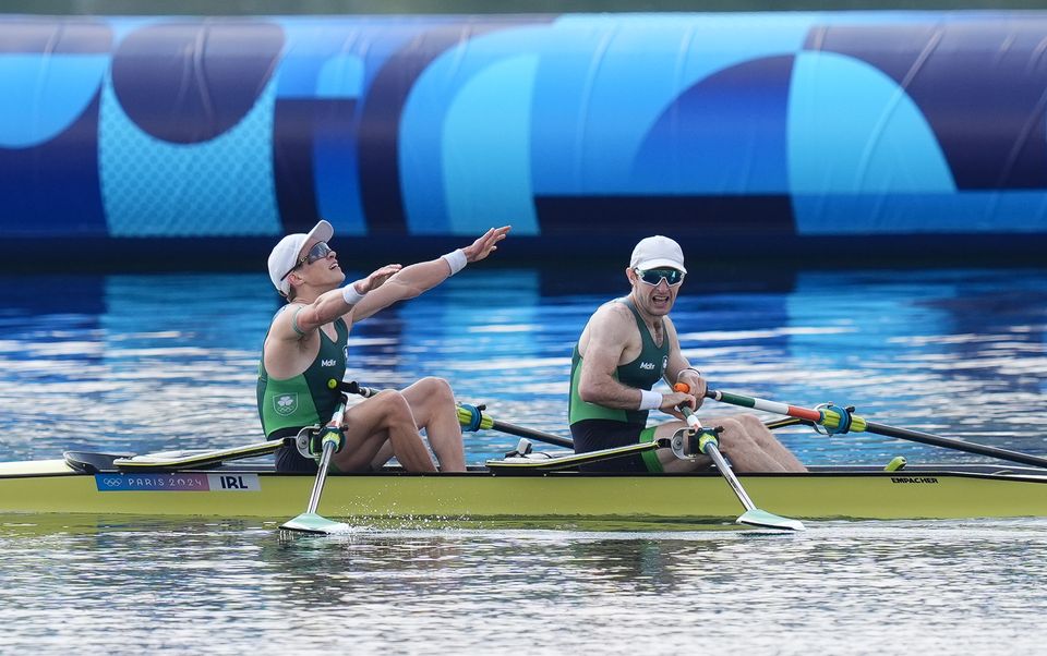 Fintan McCarthy and Paul O’Donovan celebrate winning gold in the lightweight men’s double sculls (John Walton/PA)