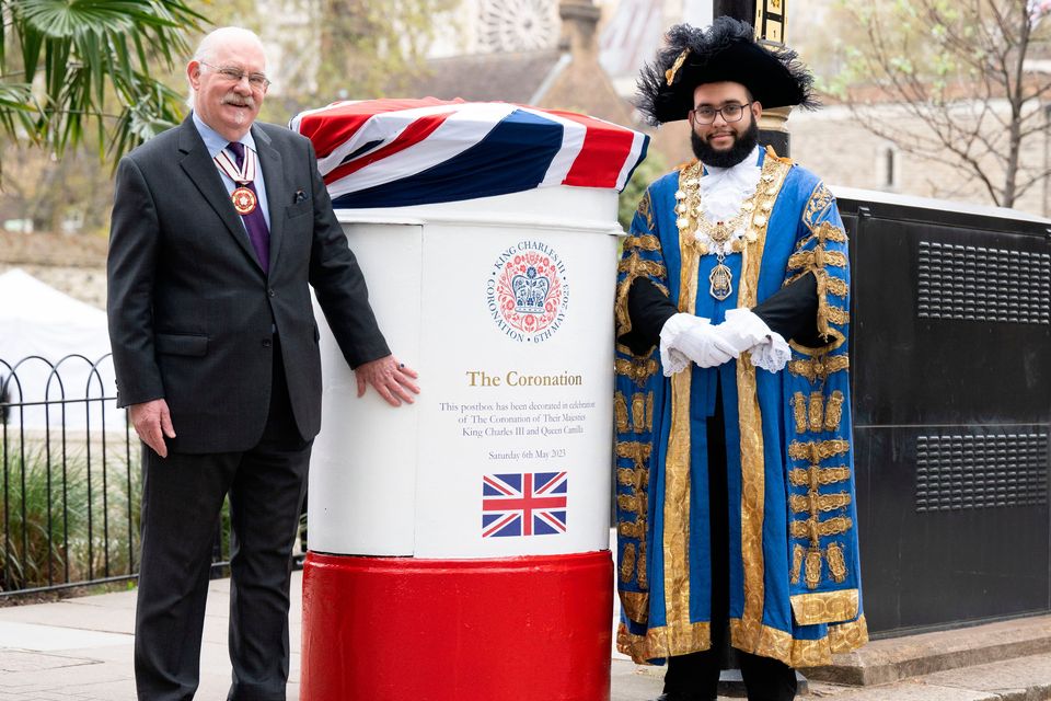 The post box in Westminster is unveiled by Kevin Traverse-Healy, Representative Deputy Lieutenant for Westminster (left) and the Right Worshipful The Lord Mayor of Westminster, Councillor Hamza Taouzzale