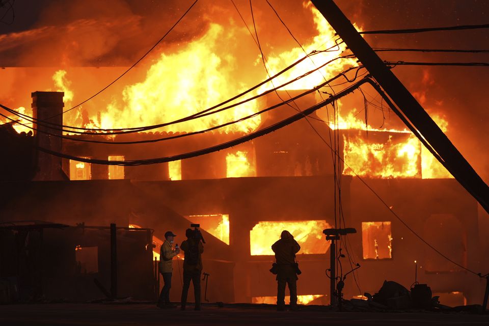 Beach front homes were destroyed by fire in Malibu (Mark J Terrill/AP)