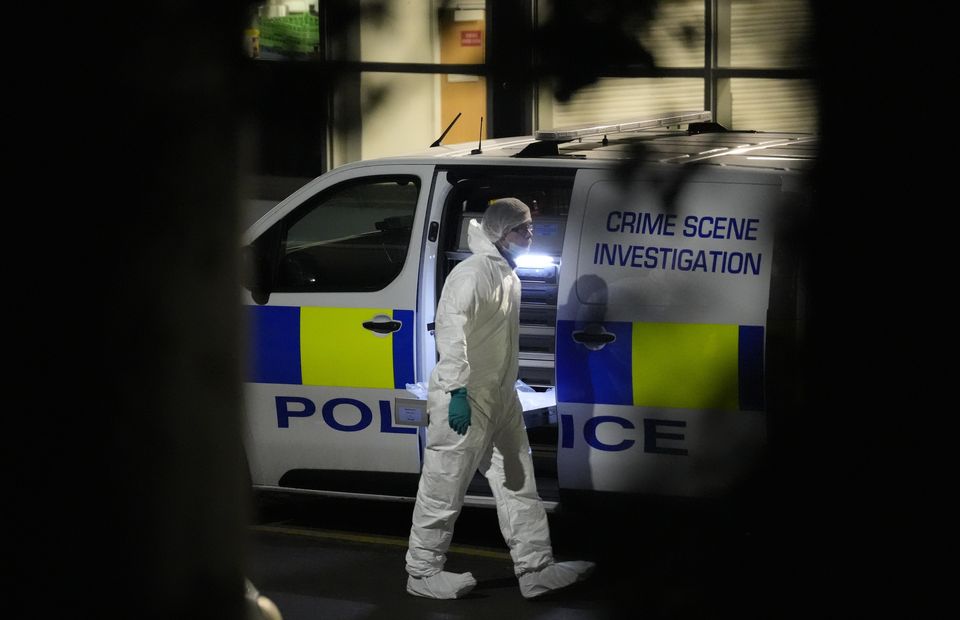 A scenes of crime officer outside All Saints Catholic High School on Granville Road, Sheffield (Danny Lawson/PA)