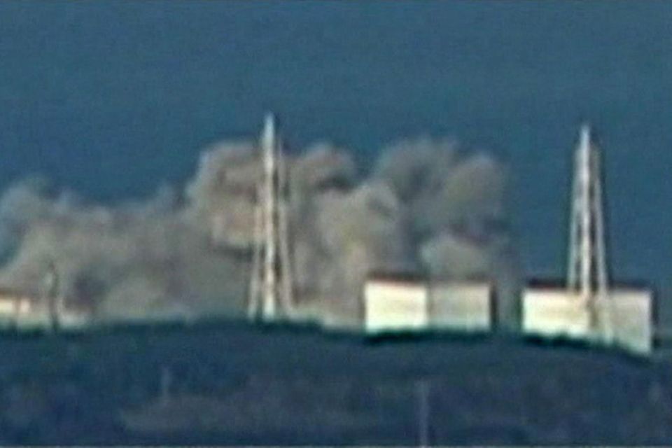 In this video image taken from NTV Japan via APTN, smoke rises from Unit 1 of Fukushima Daiichi nuclear power plant in Okumamachi, Fukushima prefecture, Japan, Saturday, March 12, 2011.   Government spokesman Yukio Edano said the explosion destroyed the exterior walls of the building where the reactor is placed, but not the metal housing enveloping the nuclear reactor, however the government has ordered the evacuation of all people within a 12-miles radius of the plant