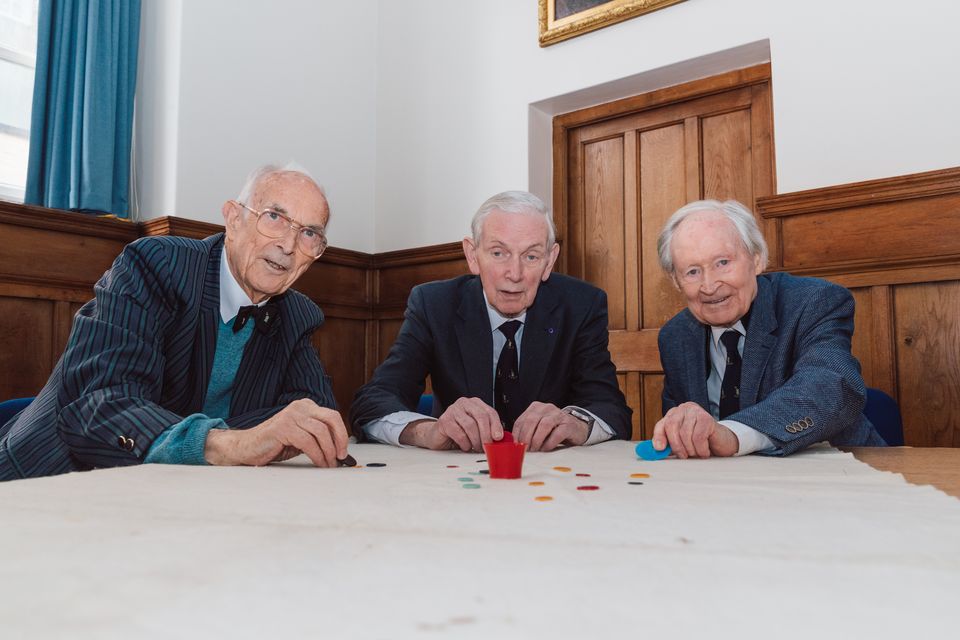 Bill Steen, Peter Downes and Lawford Howells celebrate the 70th anniversary of competitive tiddlywinks. (Cambridge University/PA)