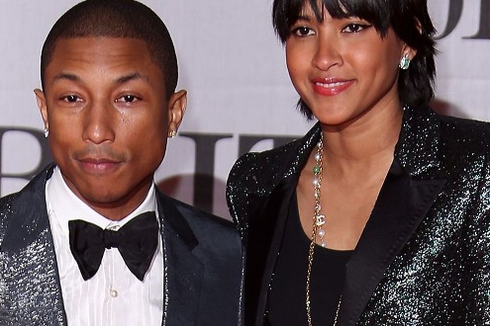 Pharrell Williams, right, and wife Helen Williams attend the
